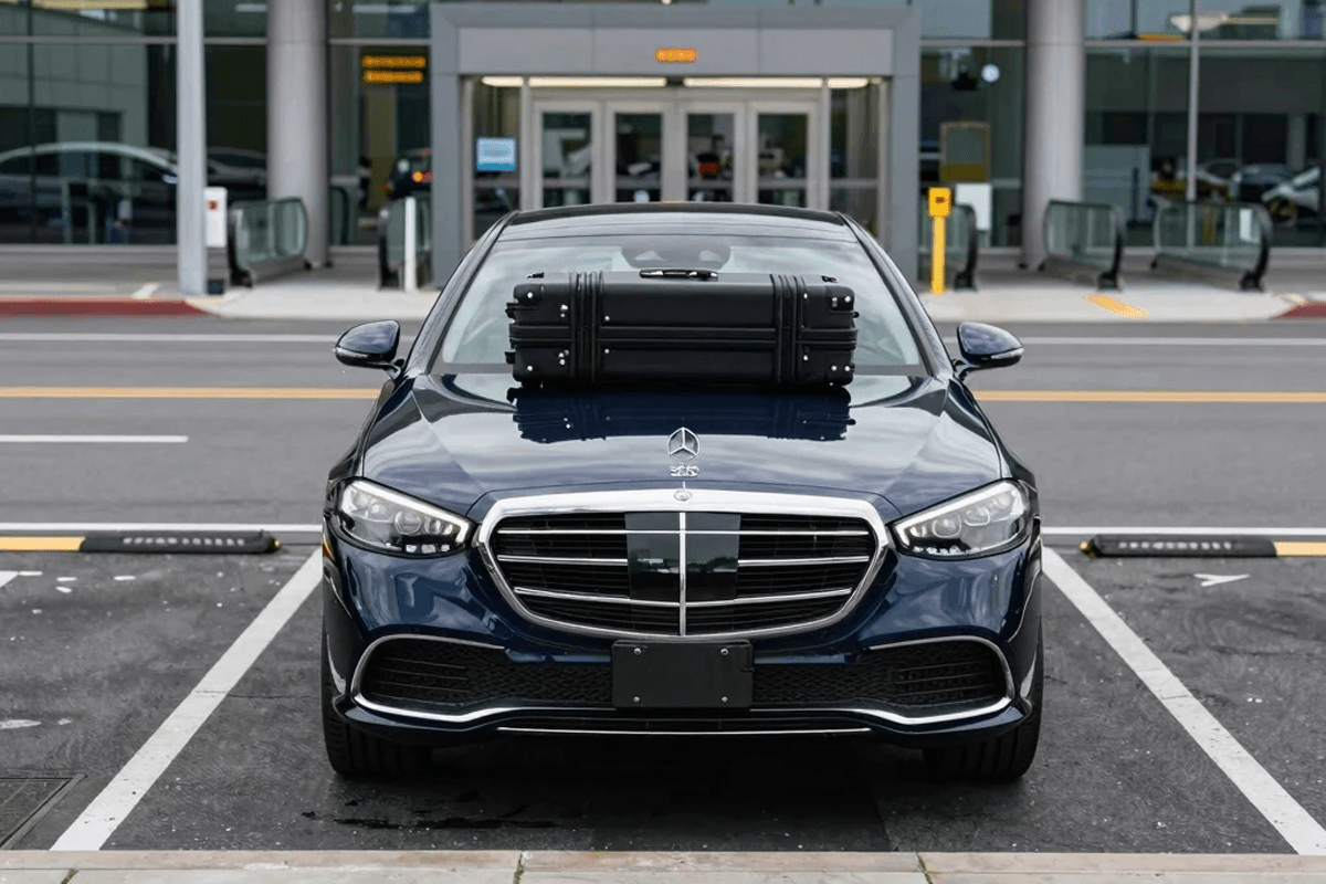 A luxury Mercedes-Benz S-Class S 580 parked at the terminal, providing reliable Midway Airport limo service for a business traveler.