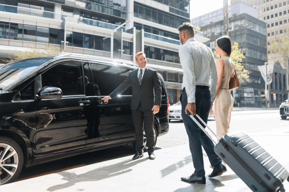 New Lenox to O'Hare Limo uniformed chauffeur greeting passenger at New Lenox home