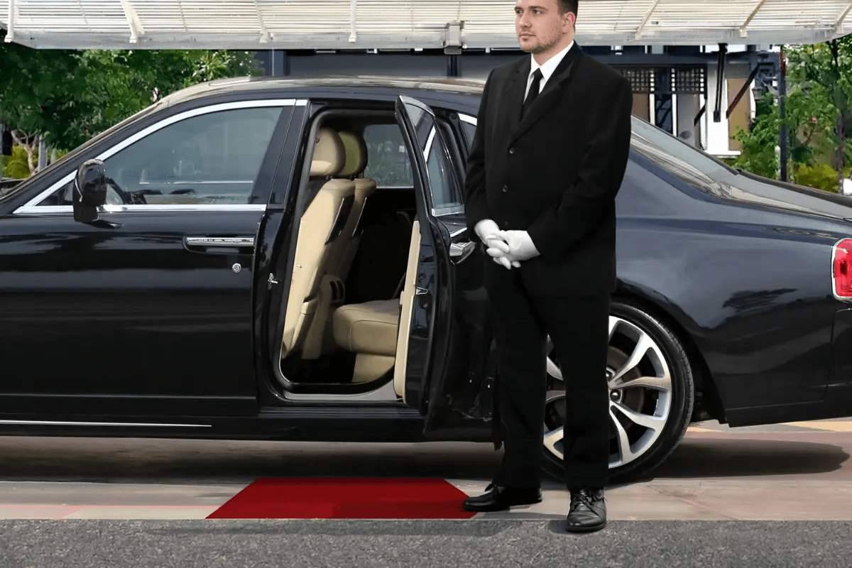 Orland Park to Midway Limo uniformed chauffeur welcoming passenger at Orland Park residence