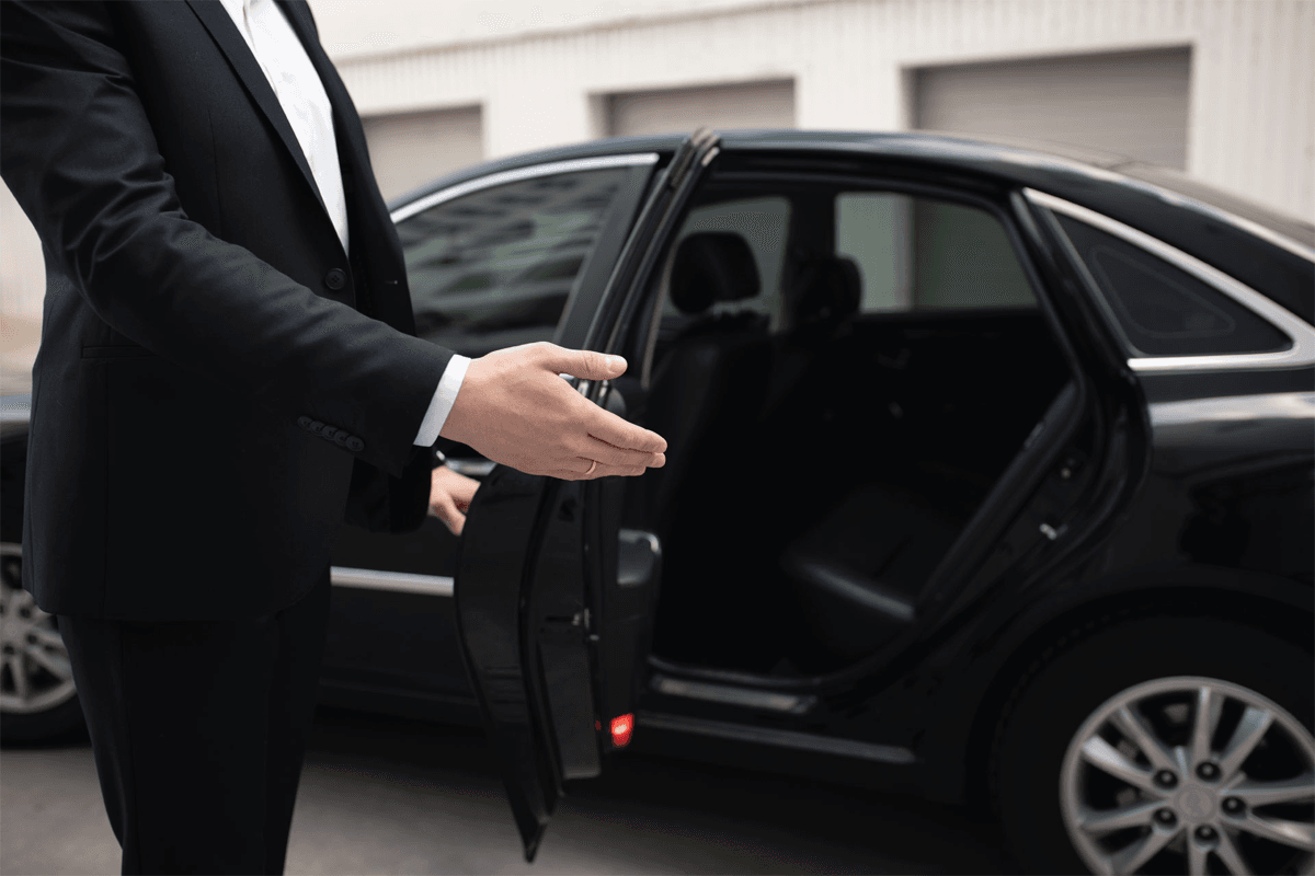 About Chicago Luxury Limo Service professional chauffeur assisting executive travelers